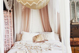 Vintage bohemian bedroom with baldaquin