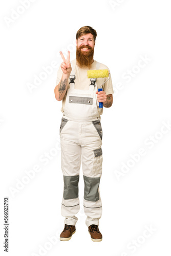 Adult painter man full body cut out isolated showing number two with fingers.