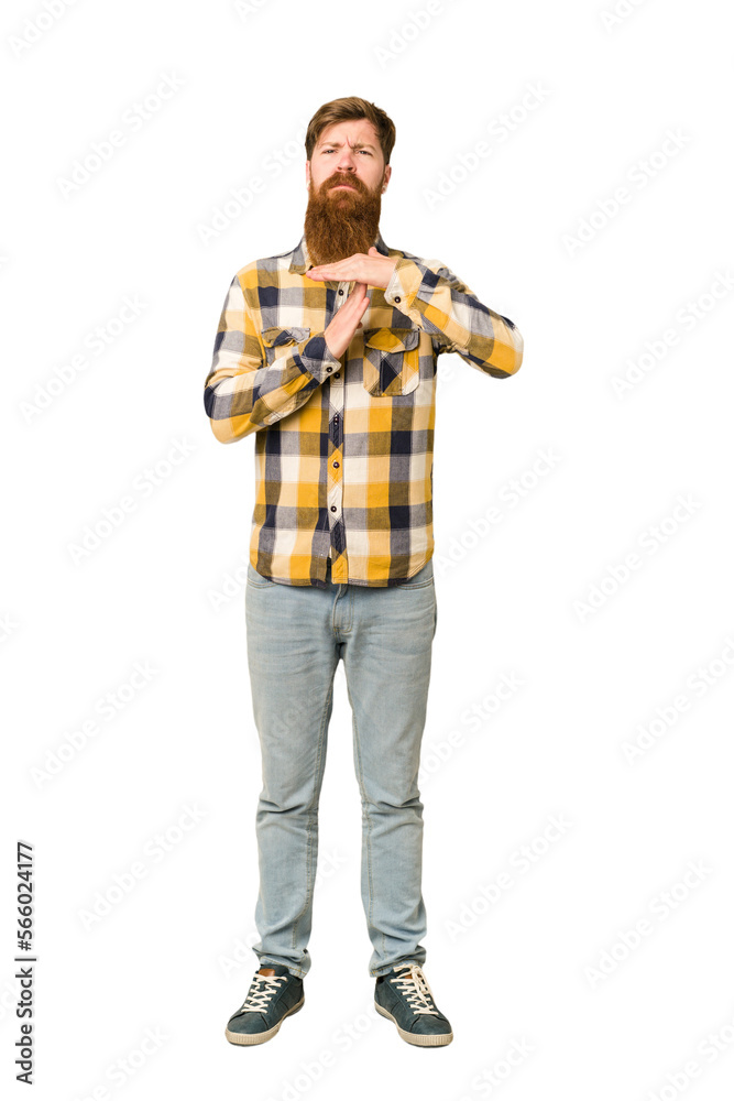 Young adult redhead man with a long beard standing full body isolated showing a timeout gesture. Young adult redhead man with a long beard standing full body isolated showing a timeout gesture.