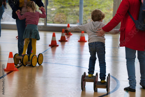 parent and child walking in the pedalo classic double candid exploring health playground woman concentration connection development exercise exercising exploration females harmony helping physio