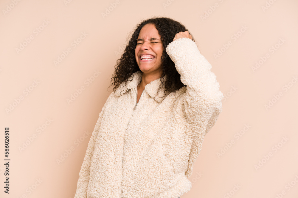 Young african american curly woman isolated celebrating a victory, passion and enthusiasm, happy expression. Young african american curly woman isolated celebrating a victory, passion and enthusiasm, happy expression.