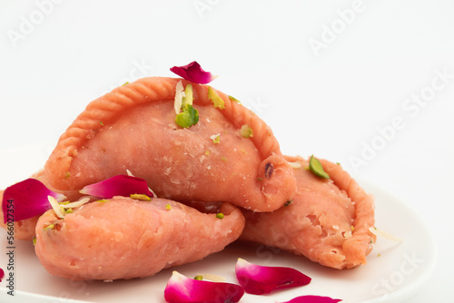Rose Gujia Mithai Also Called Gulabi Gujiya, Pirukiya, Pirukia, Pedakiya, Karanji, Basundi Gughra Made Of Suji Ghee Chironji Mawa Khoya Chasni Mava Gulab Khoa For Deepawali, Teez, Holi Teej Festival photo