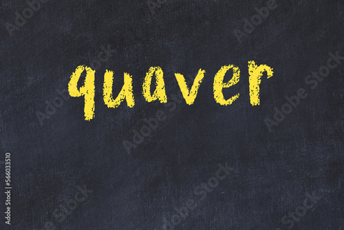 College chalk desk with the word quaver written on in