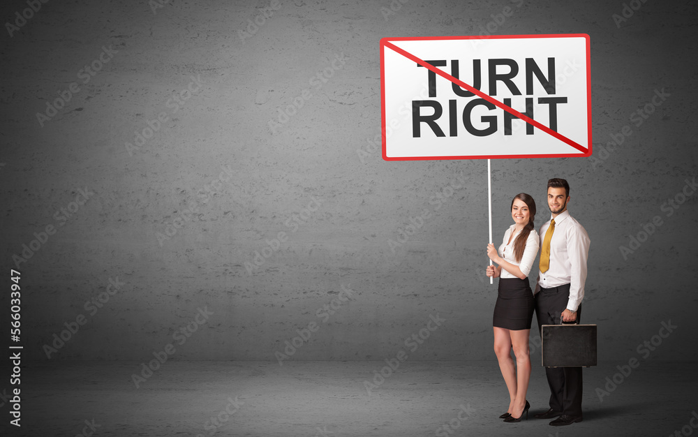 business person holding a traffic sign business person holding a traffic sign