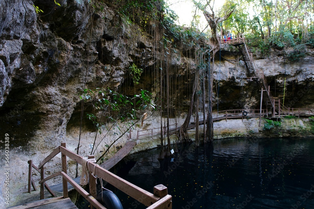 Cenote Xcanche is a stunning open cenote with swimming, zip-lining and swing jumps , there is also a waterfall cascading into the cenote. Located near Valladolid the Yucatan Peninsula , 14 11 2022.