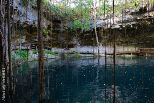 Cenote Xcanche is a stunning open cenote with swimming, zip-lining and swing jumps , there is also a waterfall cascading into the cenote. Located near Valladolid the Yucatan Peninsula , 14 11 2022. photo