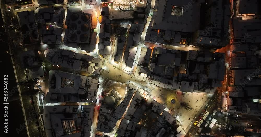 Sarajevo city hall or national library in town center aerialhyper lapse or time lapse. Landmark in capital of Bosnia and Herzegovina covered with fresh snow in the winter season at night. 