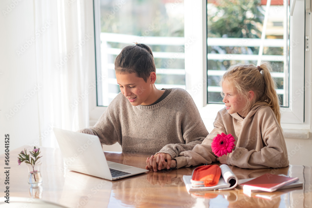 First love, young teens lovers couple studying laptop at home, holds hands, boy and girl doing homework, first dating, flower and kids love. First love, young teens lovers couple studying laptop at home, holds hands, boy and girl doing homework, first dating, flower and kids love.