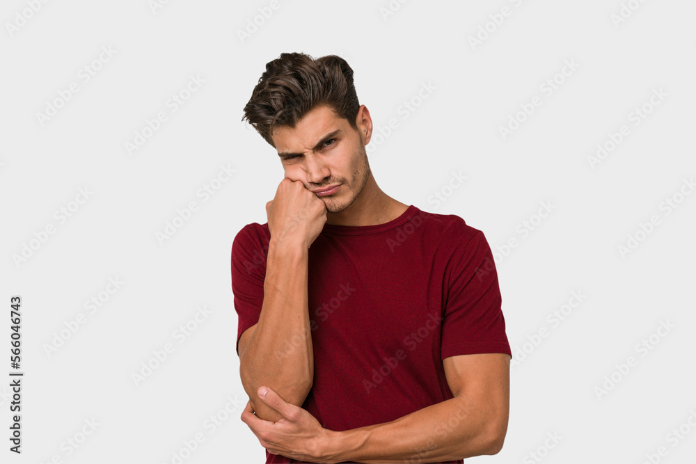 Young handsome caucasian man isolated on white background who feels sad and pensive, looking at copy space. Young handsome caucasian man isolated on white background who feels sad and pensive, looking at copy space.
