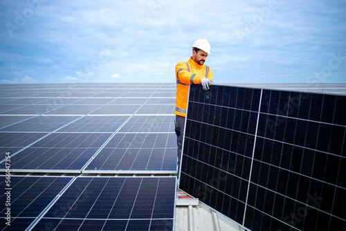 Wallpaper Mural Experienced solar panel worker installing sustainable power plant for electricity production. Torontodigital.ca