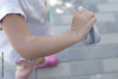 sunburn on the shoulder of a child, after a long time in the sun, the concept of skin protection.