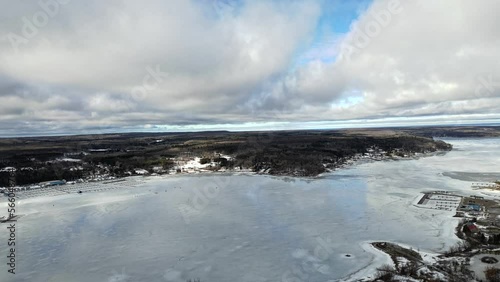 Penatange in the winter time lake simcoe clouds reflecting off the water  photo