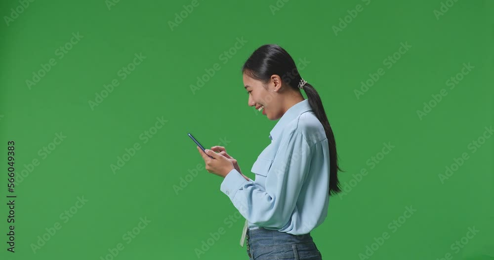 Side View Of Asian Business Woman Using Mobile Phone On Green Screen Background In The Studio
Side View Of Asian Business Woman Using Mobile Phone On Green Screen Background In The Studio