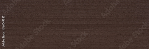 Texture of wenge wood. Dark brown wenge background. Natural brown wood texture, solid natural wood for furniture production
