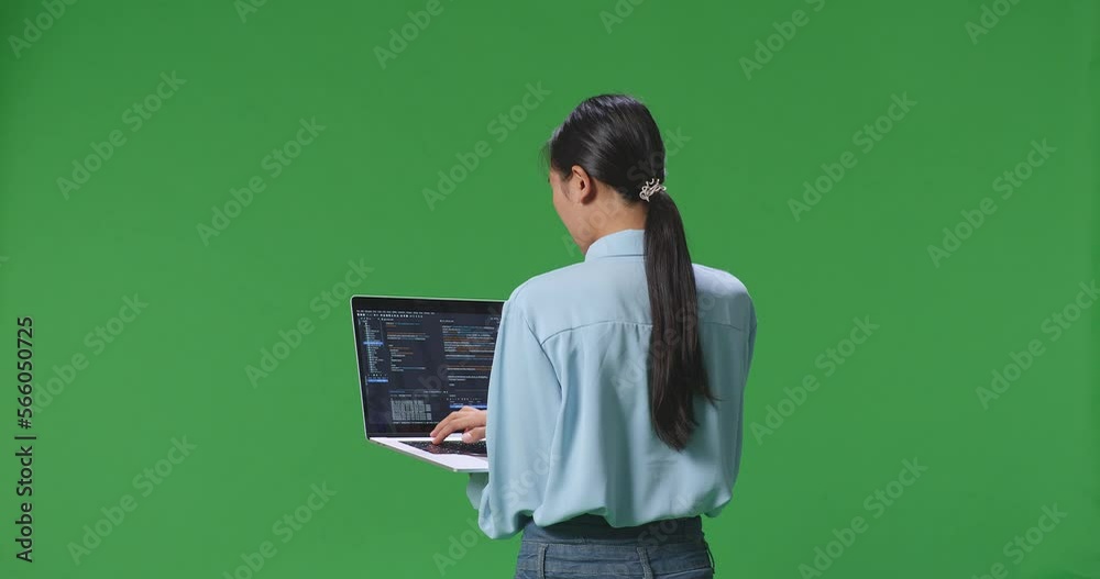 Back View Of Asian Business Woman Using Laptop Computer On Green Screen Background In The Studio, Computer Display Showing Code
Back View Of Asian Business Woman Using Laptop Computer On Green Screen Background In The Studio, Computer Display Showing Code