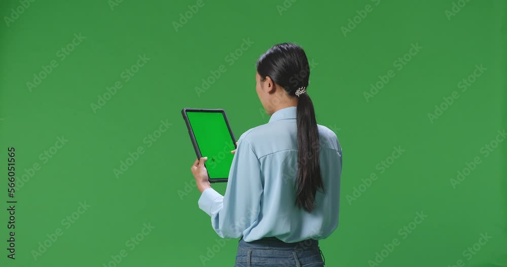 Back View Of Asian Business Woman Using Tablet With Mock Up Green Screen On Green Screen Background In The Studio
Back View Of Asian Business Woman Using Tablet With Mock Up Green Screen On Green Screen Background In The Studio