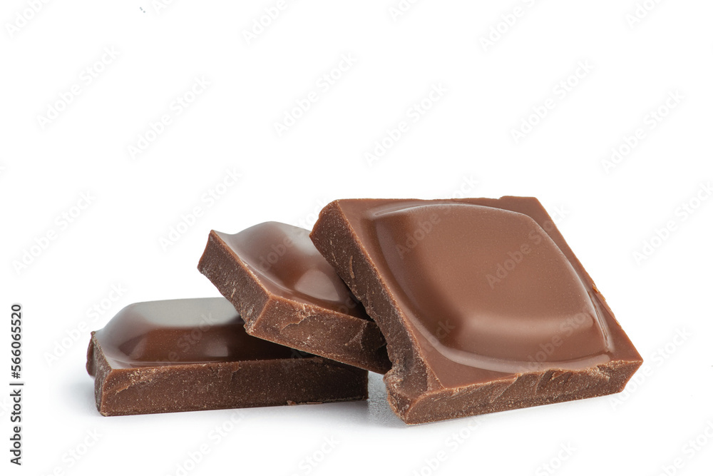 Pieces of milk chocolate on a white background Pieces of milk chocolate on a white background