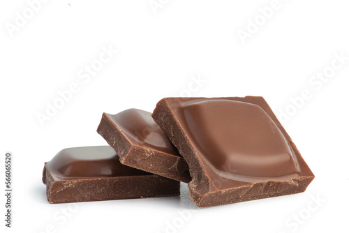 Pieces of milk chocolate on a white background
