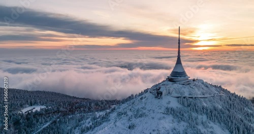 Jested tower hyperlapse mountain hill with snow mist and fog at golden hour
