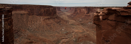 Andy Lewis tapes a world record highline, three hundred and forty feet long, at the Fruit Bowl in Moab, Utah, USA.