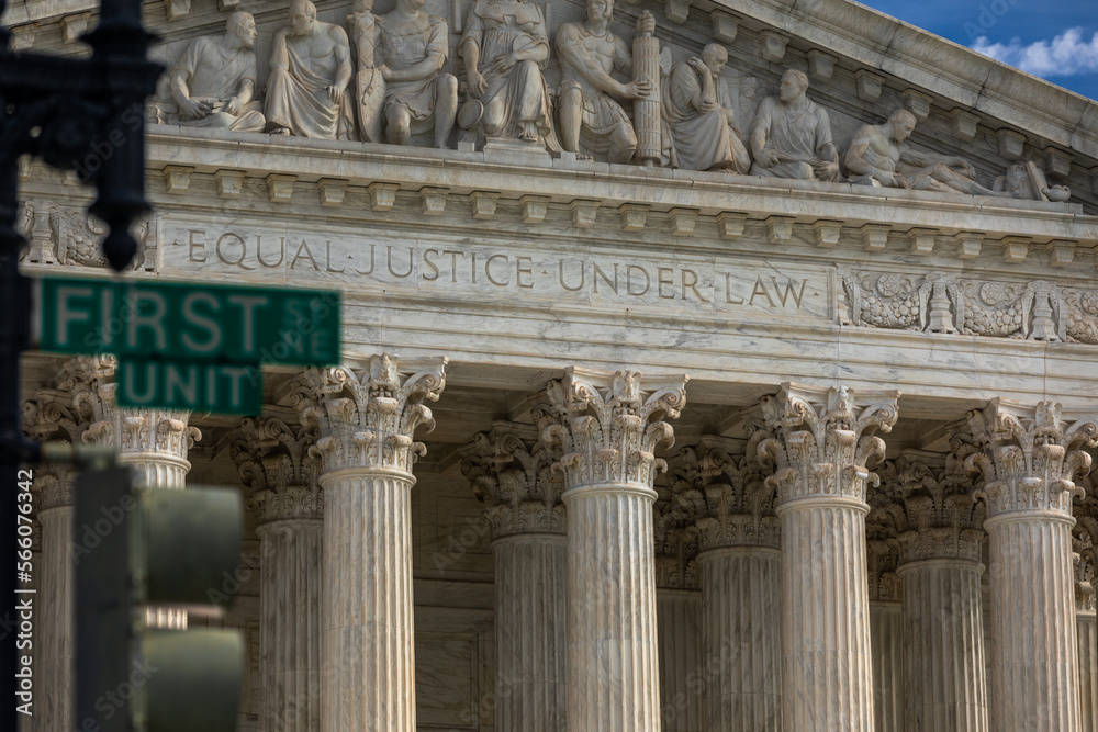 Partial View of the United States Supreme Court Building with Street Sign 