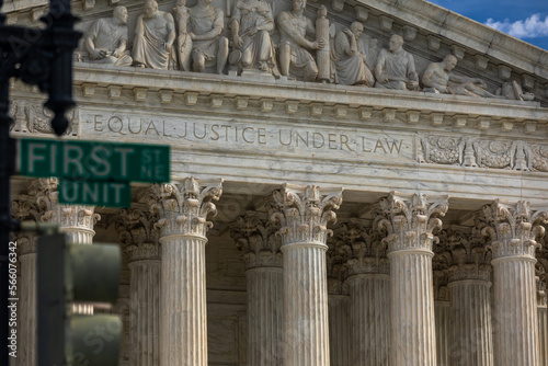 Partial View of the United States Supreme Court Building with Street Sign "First Street NE" blurred in Foreground