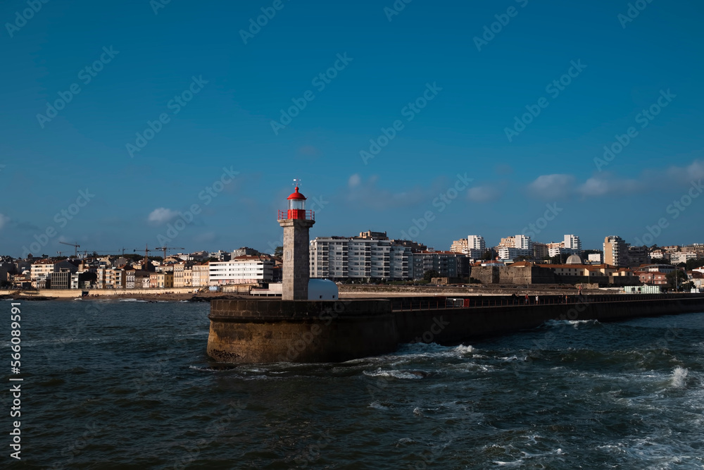 View of the ocean lighthouse on the coast in Porto, Portugal.