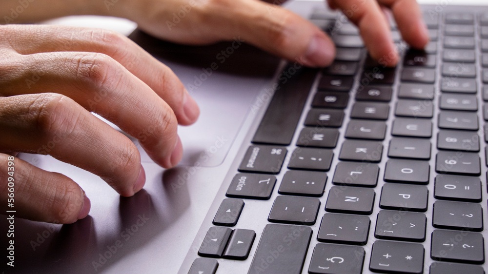 Hands of young boy typing on laptop Hands of young boy typing on laptop