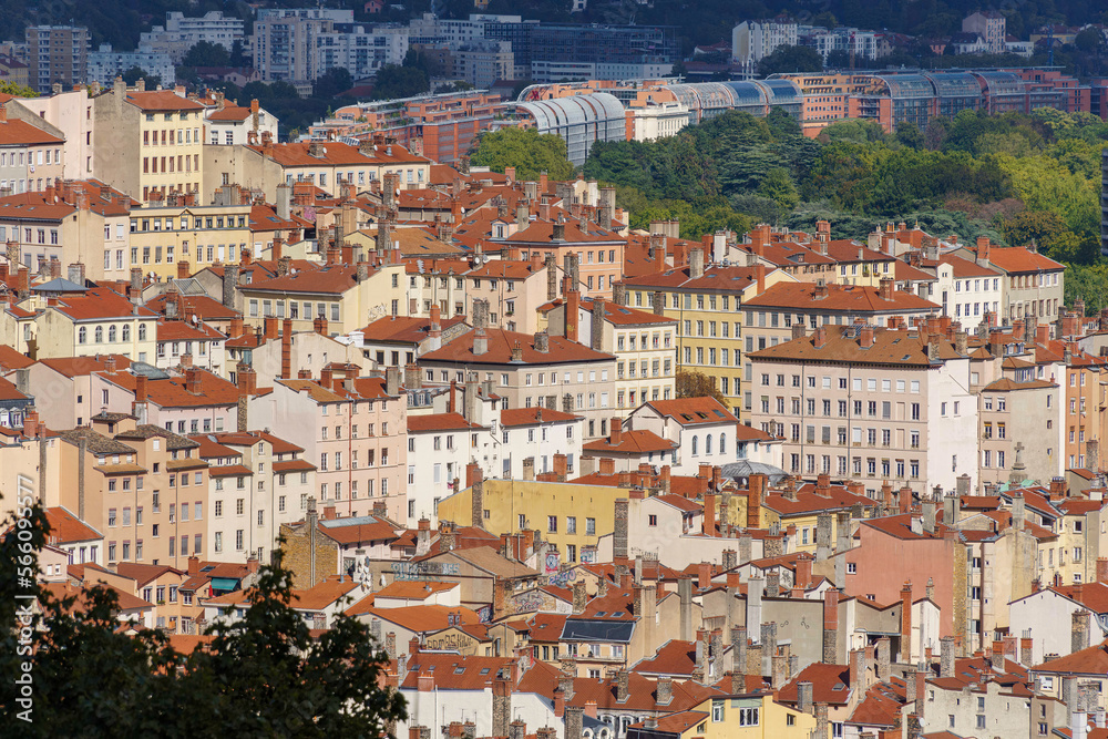 Older buildings and chimneys gradually give way to more modern structures up the hill in Lyon, France
