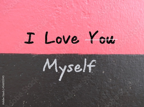 Gray and pink background with chalk handwritten text I LOVE YOU (cross out you) MYSELF, concept of self-love affirmation , self acceptance before romantic relationship 