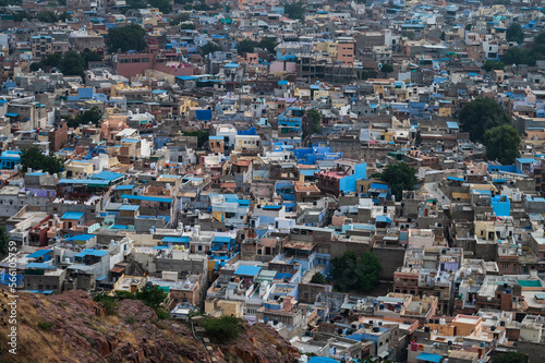Beautiful top view of Jodhpur city from Mehrangarh fort, Rajasthan, India. Jodhpur is called Blue city since Hindu Brahmis there worship Lord Shiva, whose colour is blue, they painted houses in blue. © mitrarudra