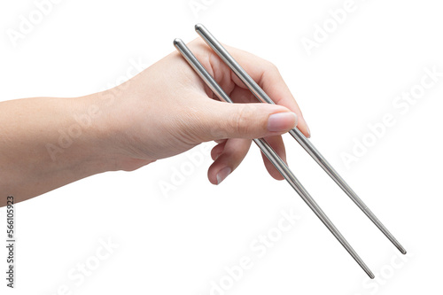 isolated of a woman's hand holding a silver chopstick.