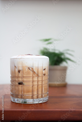 Iced coffee with micro foam in coffee shop