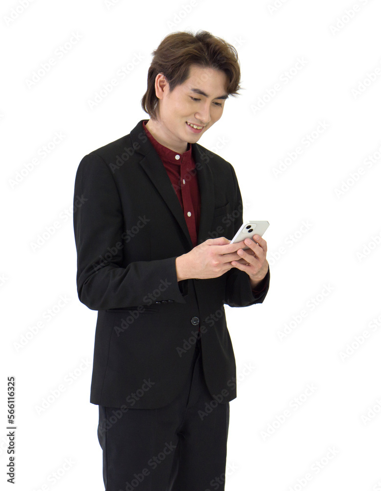Young asian businessman in black suit reading text message on mobile phone. Portrait on white background with studio light. Young asian businessman in black suit reading text message on mobile phone. Portrait on white background with studio light.