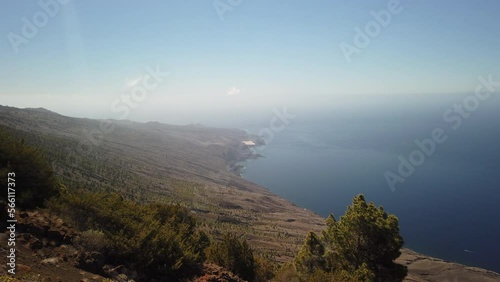 woman with her back turned, takes pictures of the spectacular landscape that can be seen from the La Peña viewpoint on the island of El Hierro on a sunny day. Canary Islands. Spain. photo