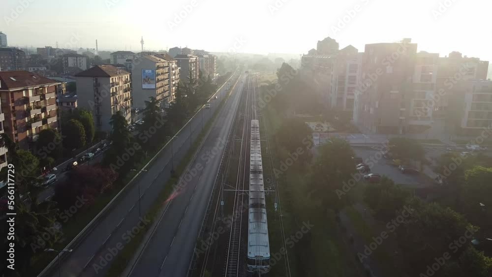 Milano subway transportation in living district, aerial drone view on sunny evening Milano subway transportation in living district, aerial drone view on sunny evening