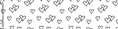 Seamless abstract pattern of small black contour hearts. Hand drawn doodle background, texture for textile, wrapping paper, Valentine's day, romantic design