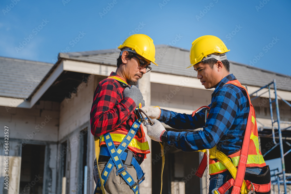 Construction worker portrait with two construction workers Wearing safety clothes and safety equipment on the construction site for safety at work. teamwork concept Construction worker portrait with two construction workers Wearing safety clothes and safety equipment on the construction site for safety at work. teamwork concept