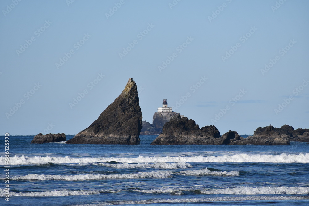 Naklejka premium Oregon coastal rock formations, Tilamook Lighthouse in the background.