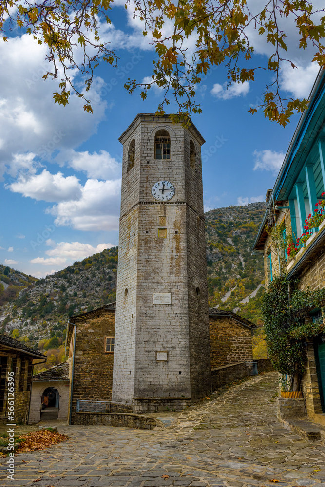 The picturesque village of Tsepelovo during fall season with its architectural traditional old stone  buildings and the famous clock tower,  located on Tymfi mount, Zagori, Epirus, Greece, Europe