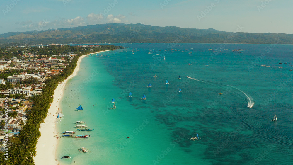 Fototapeta premium Tropical beach with tourists and clear blue sea, top view. Summer and travel vacation concept. Boracay, Philippines