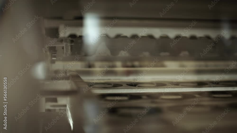 Inside of a printing machine, parts of machine moving in a loop. Inside of a printing machine, parts of machine moving in a loop.