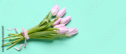 Bouquet of beautiful tulip flowers on color background with space for text