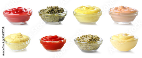 Group of tasty sauces in bowls on white background