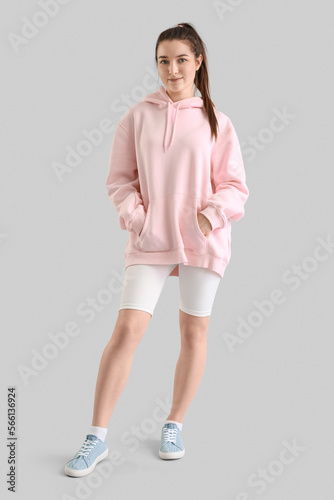 Young woman in pink hoodie ...