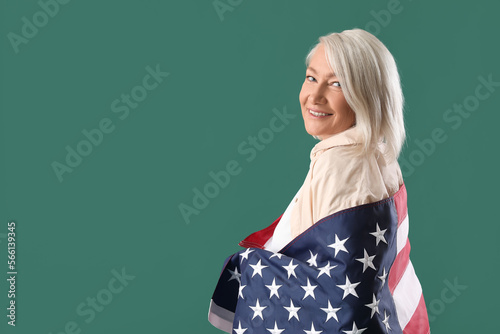 Mature woman with USA flag ...