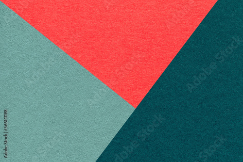 Texture of craft red, cyan and emerald shade color paper background, macro. Vintage abstract teal cardboard