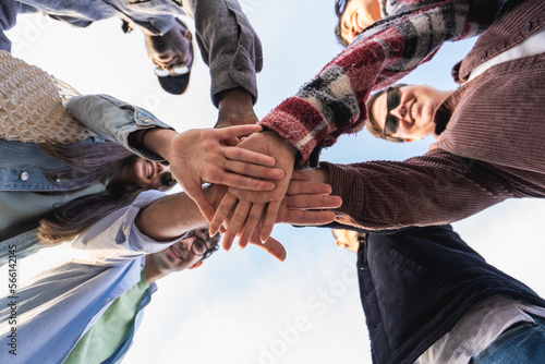 Unity in Diversity - multiethnic people joining hands together