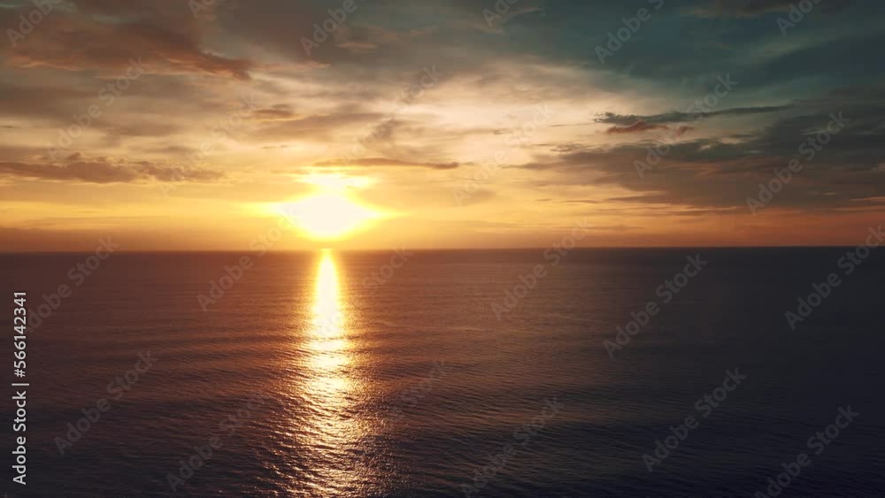 Shadows and sunlight of sunset on sea water in sky reflection