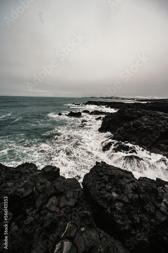 Brimketill lava rock pool - natural pool at the bottom of the cliffs, located on the Reykjanes Peninsula, west of the Grindavik, Iceland. photo